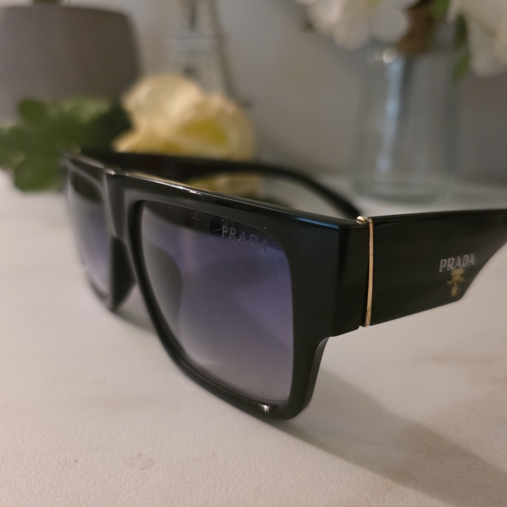 Prada Elegant Black Sunglasses with Gold Detail